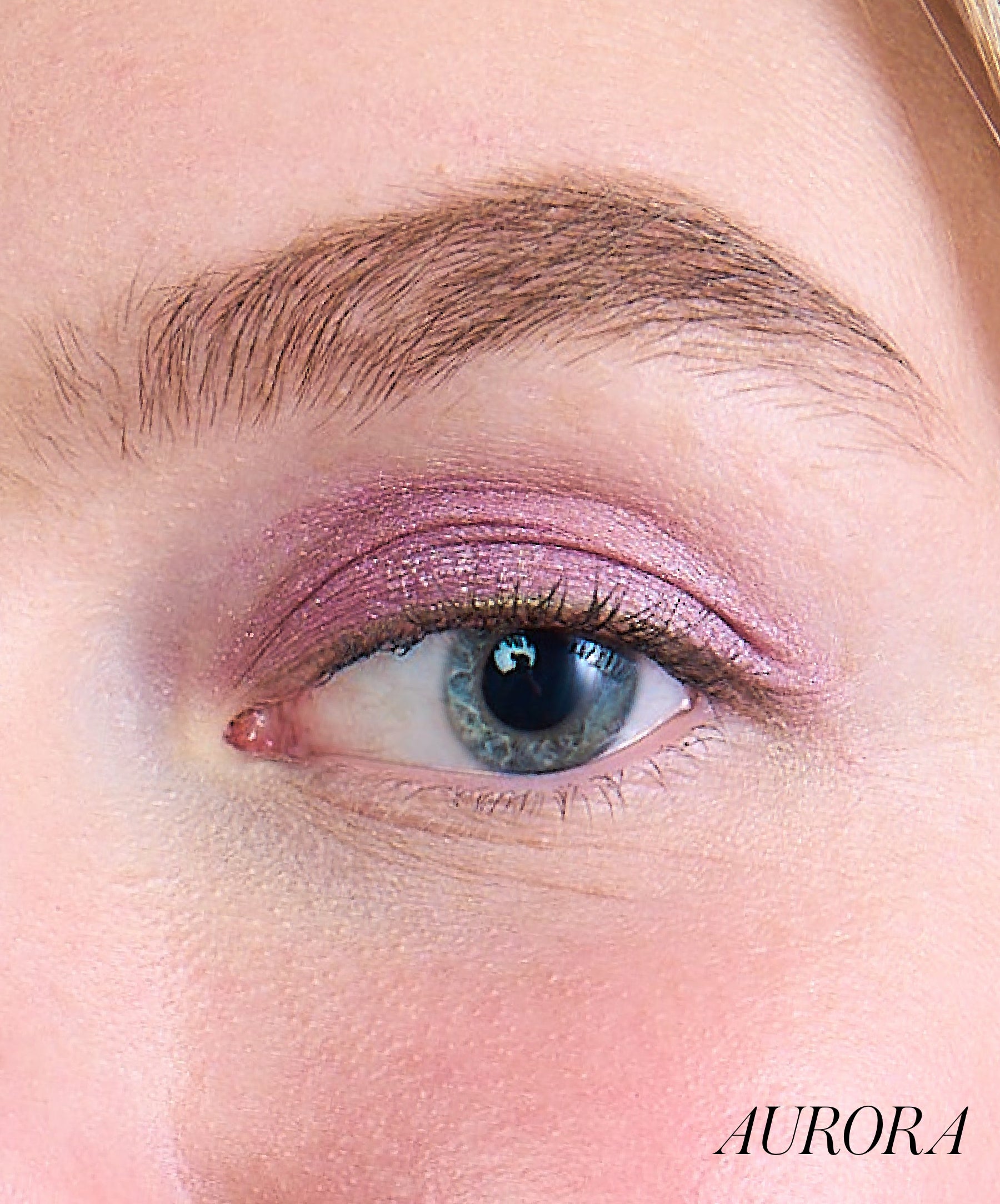 Close-up of model wearing RMS Eyelights Cream Eyeshadow shade Aurora