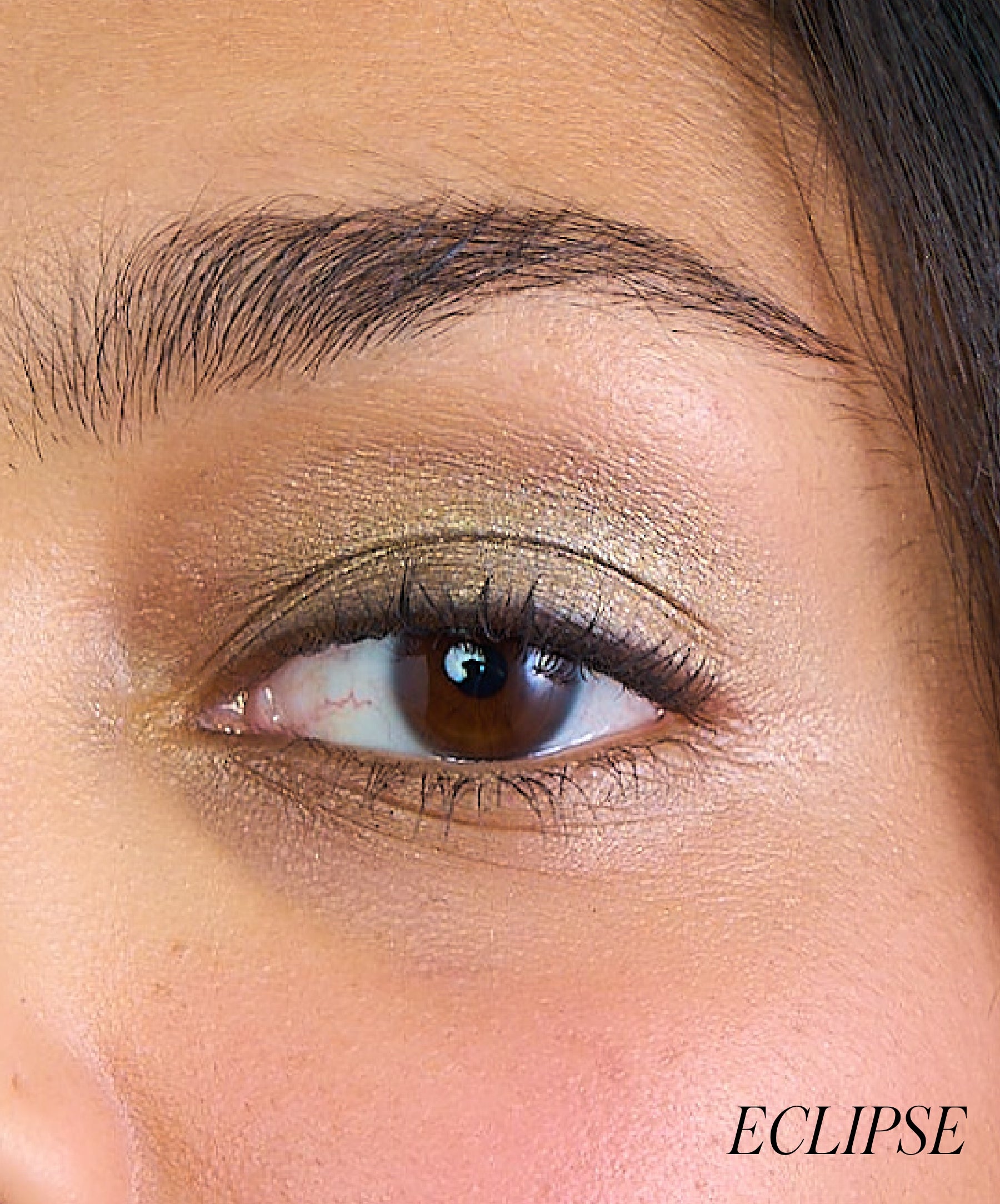 Close-up of model wearing RMS Eyelights Cream Eyeshadow shade Eclipse