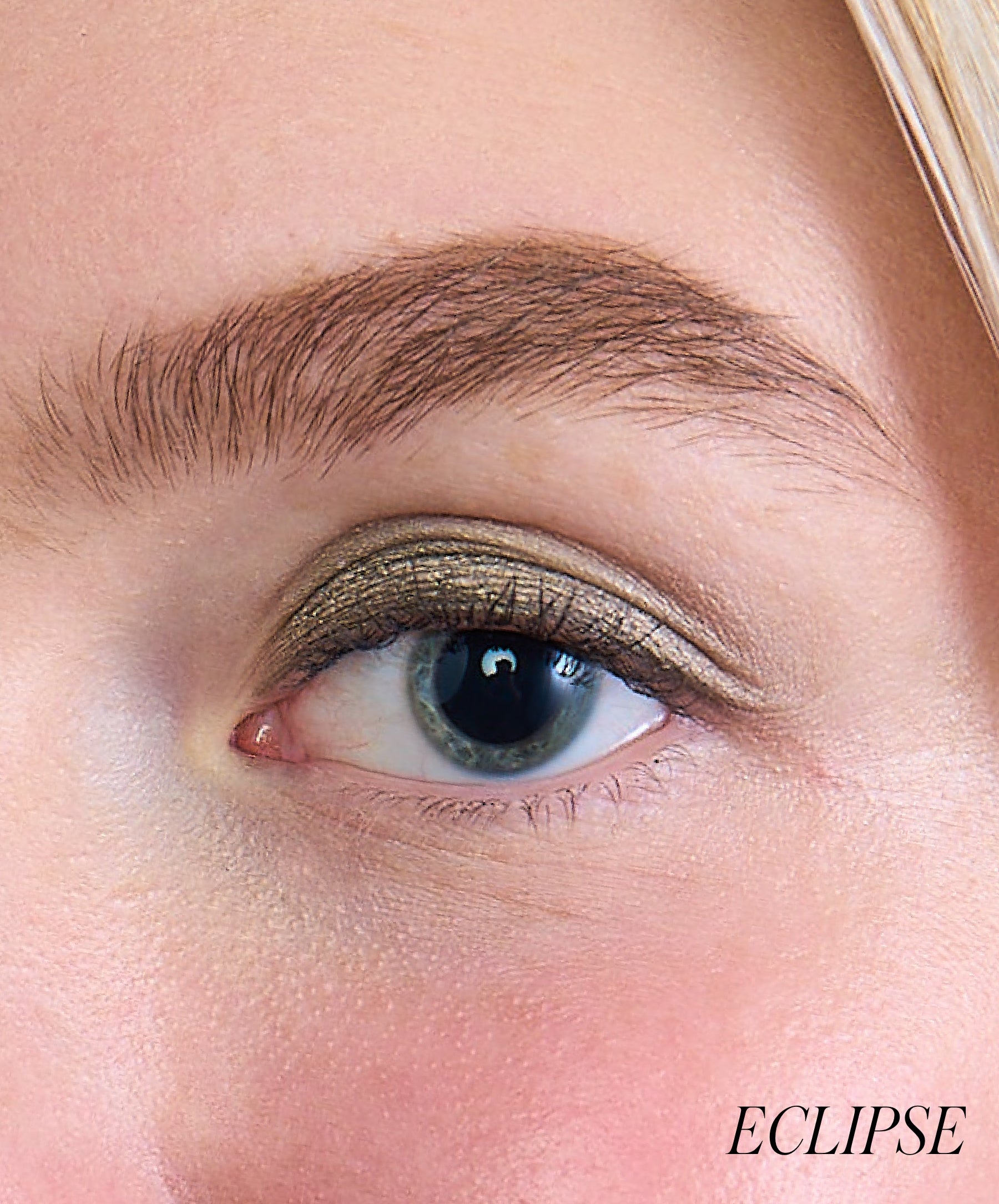 Close-up of model wearing RMS Eyelights Cream Eyeshadow shade Eclipse