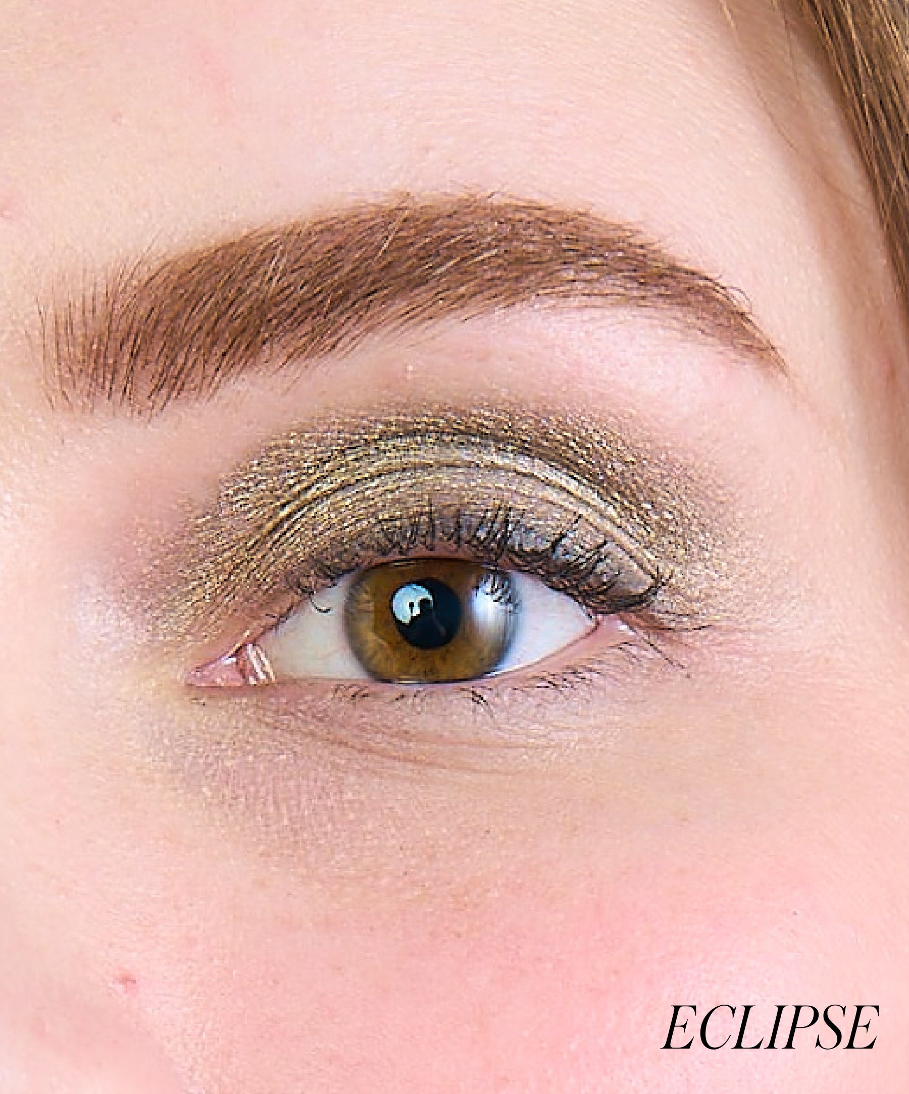 Close-up of model wearing RMS Eyelights Cream Eyeshadow shade Eclipse