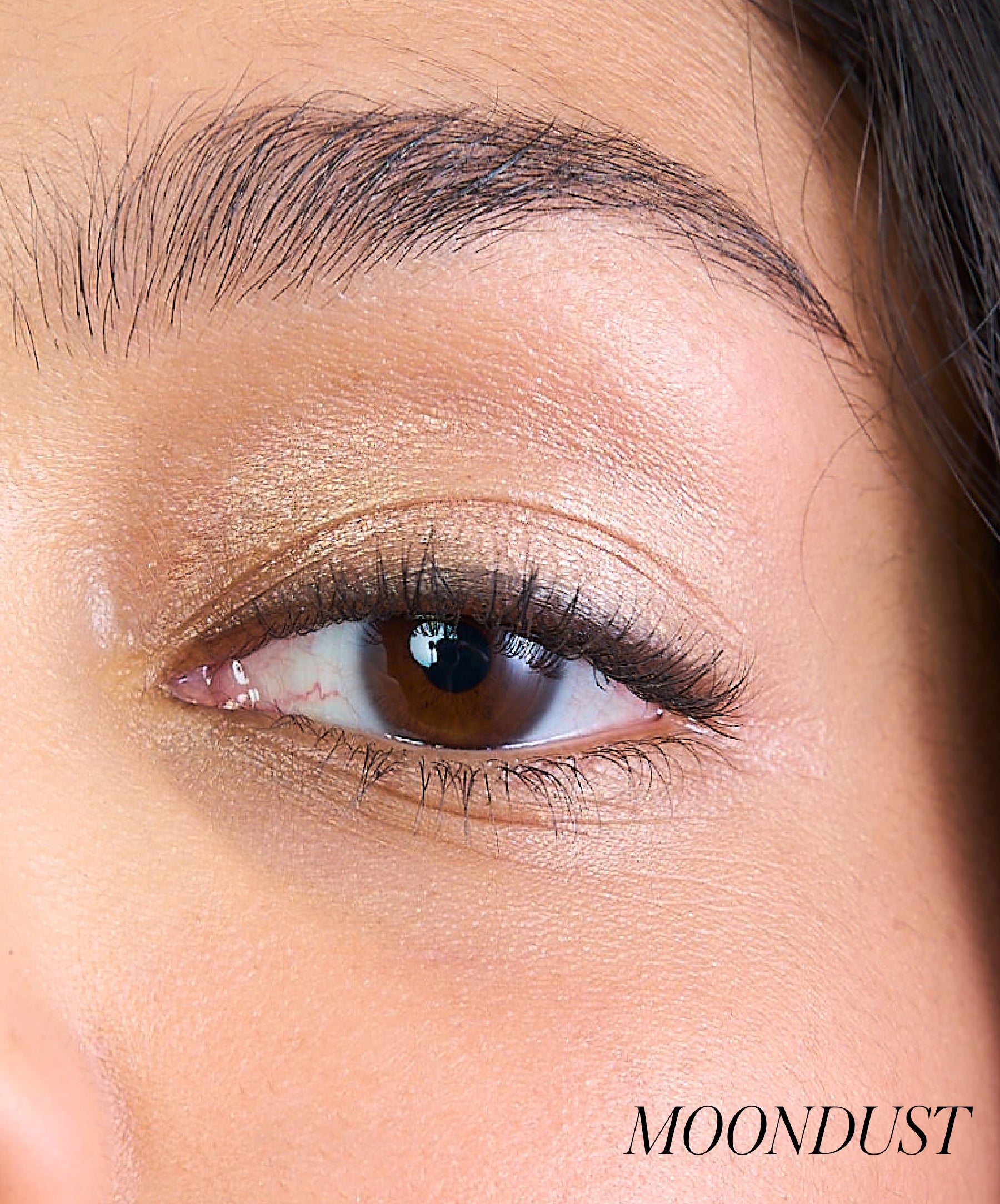 Close-up of model wearing RMS Eyelights Cream Eyeshadow shade Moondust