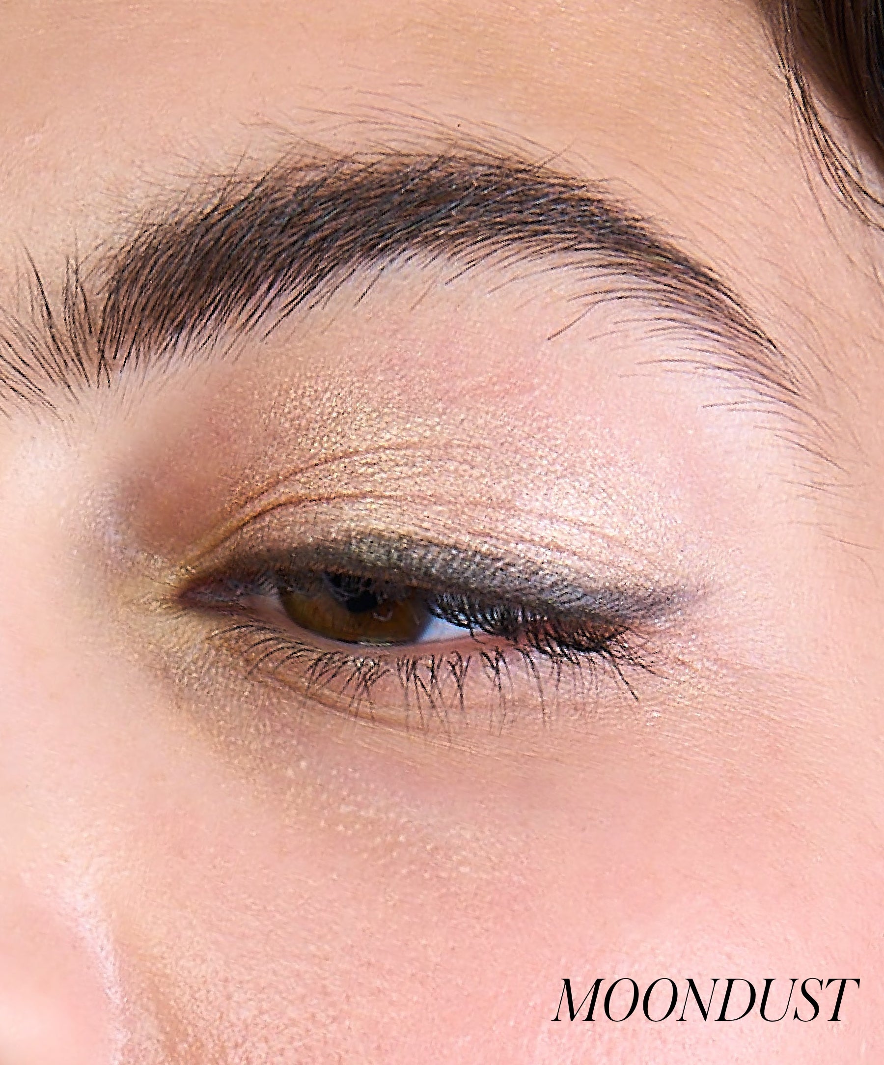 Close-up of model wearing RMS Eyelights Cream Eyeshadow shade Moondust