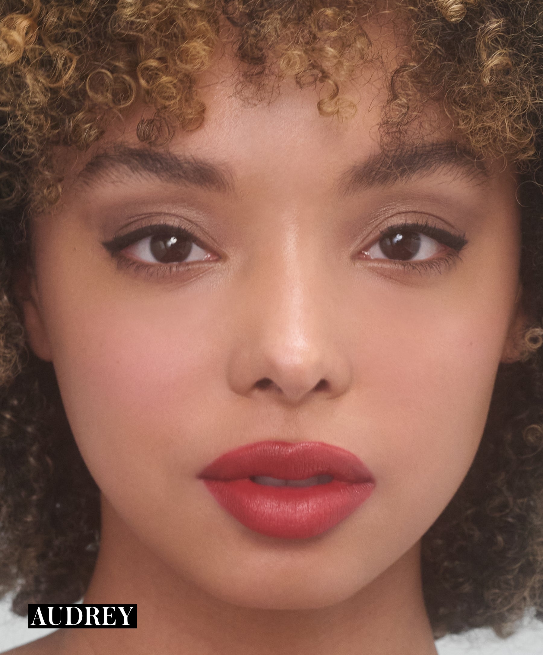 Model wearing RMS Legendary Serum Lipstick in shade Audrey