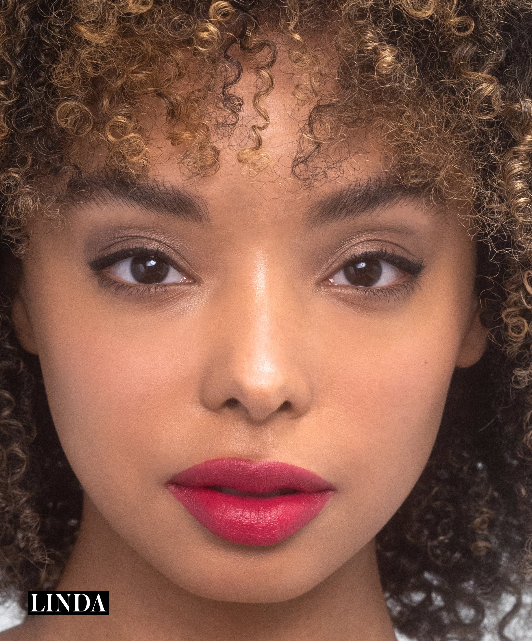 Model wearing RMS Legendary Serum Lipstick in shade Linda