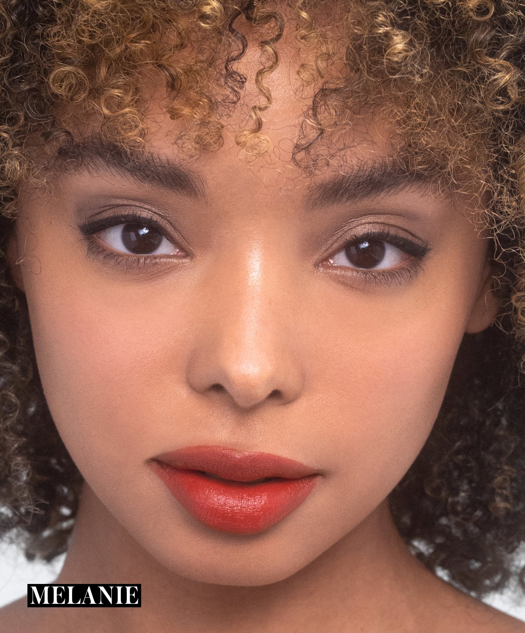Model wearing RMS Legendary Serum Lipstick in shade Melanie