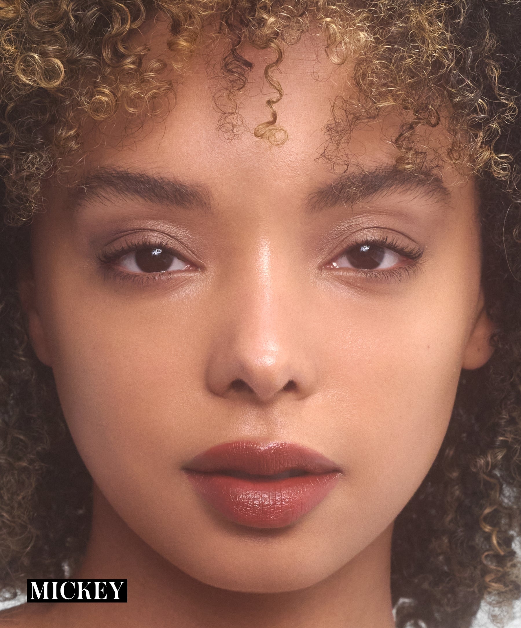 Model wearing RMS Legendary Serum Lipstick in shade Mickey