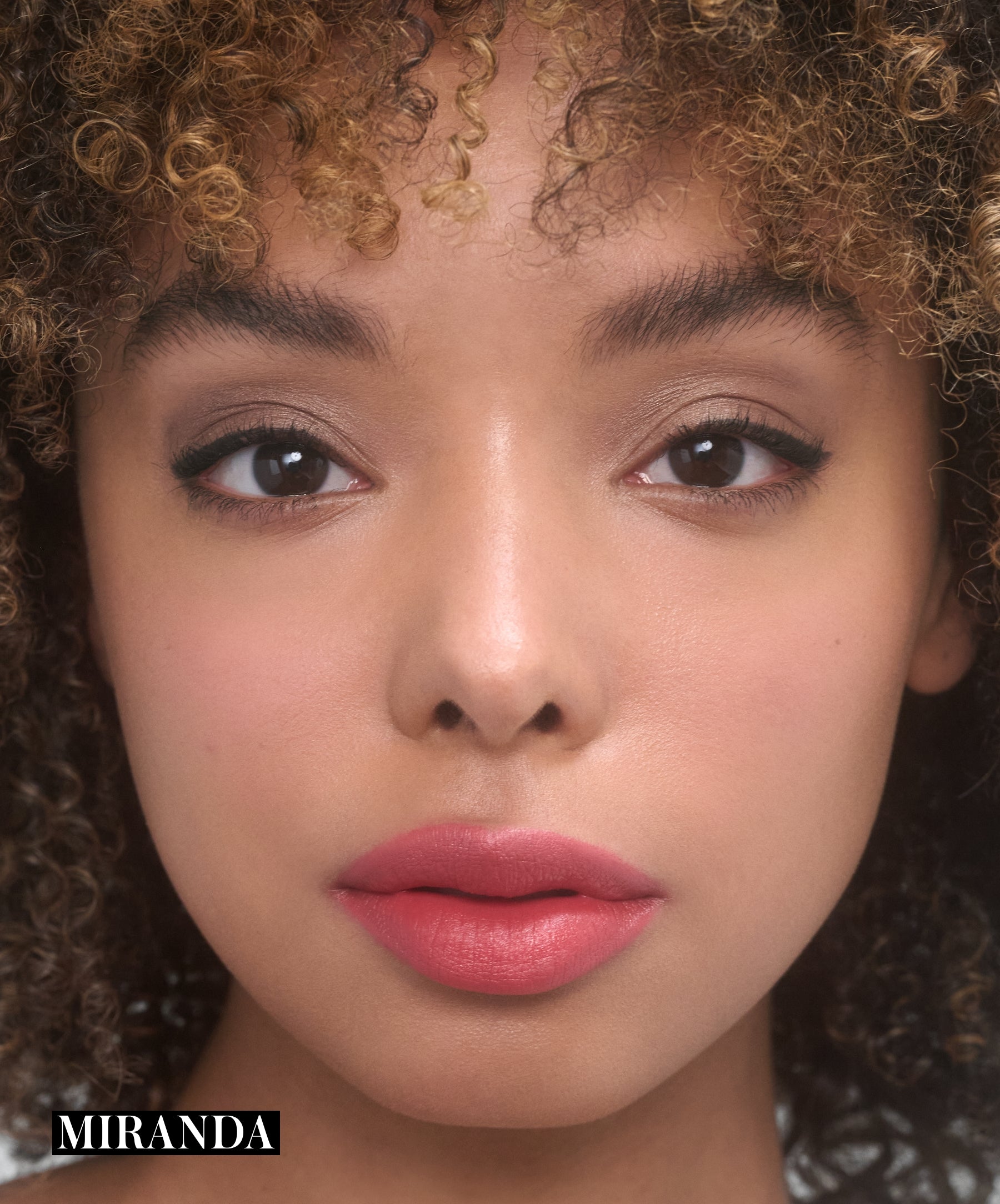 Model wearing RMS Legendary Serum Lipstick in shade Miranda