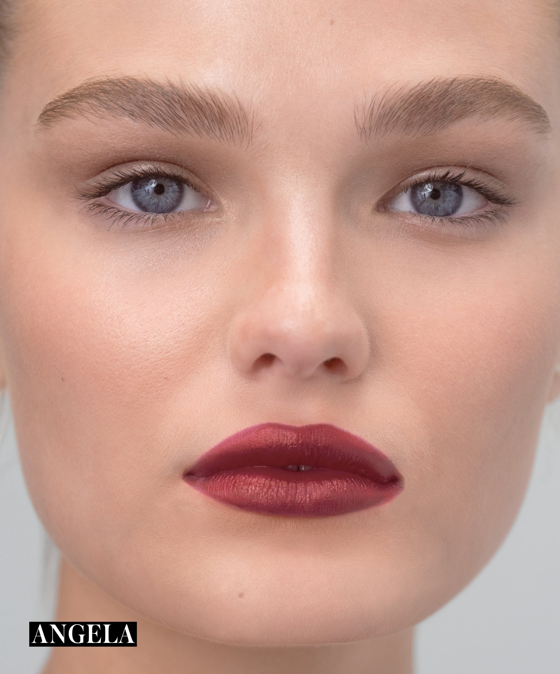 Model wearing RMS Legendary Serum Lipstick in shade Angela