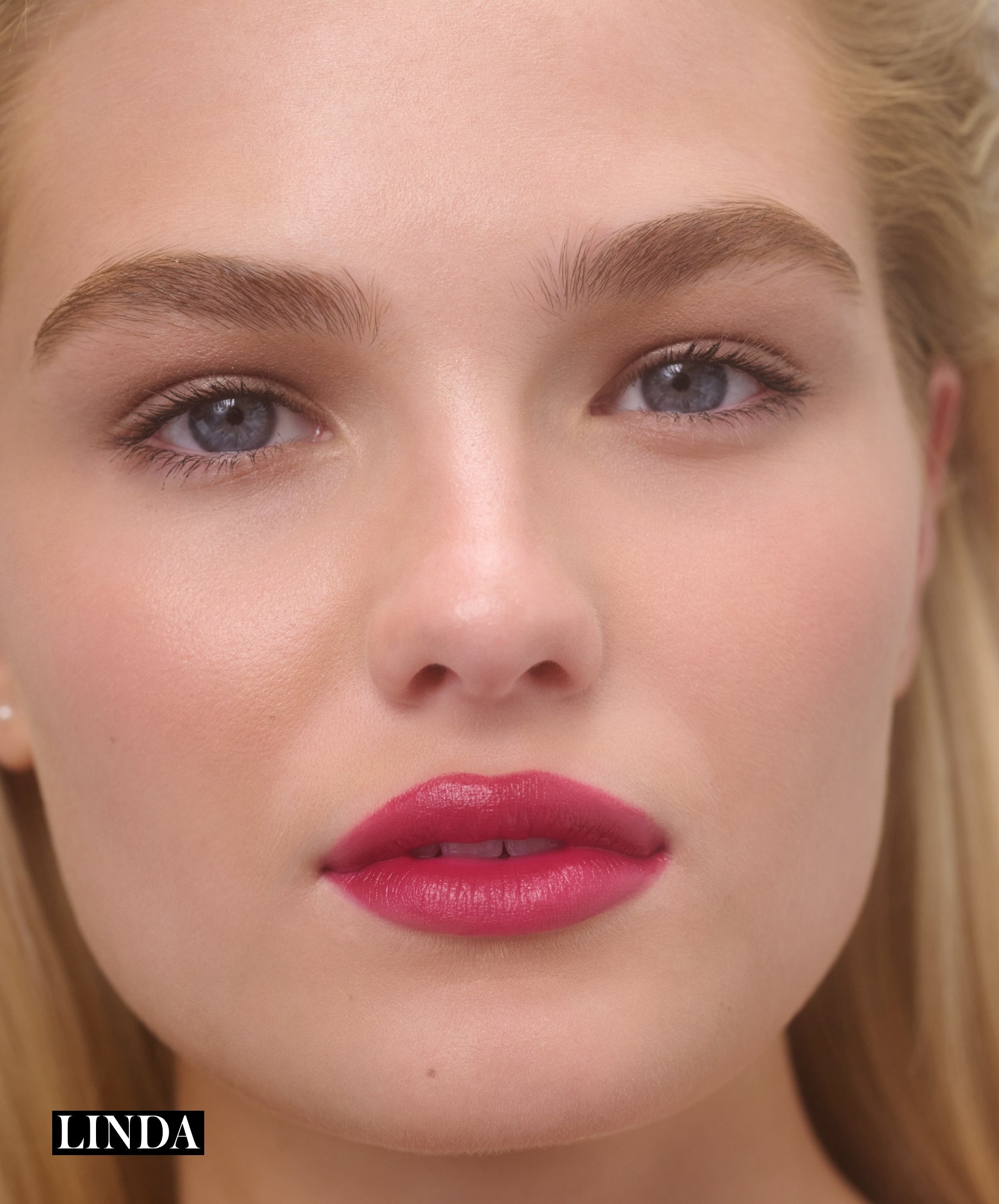 Model wearing RMS Legendary Serum Lipstick in shade Linda