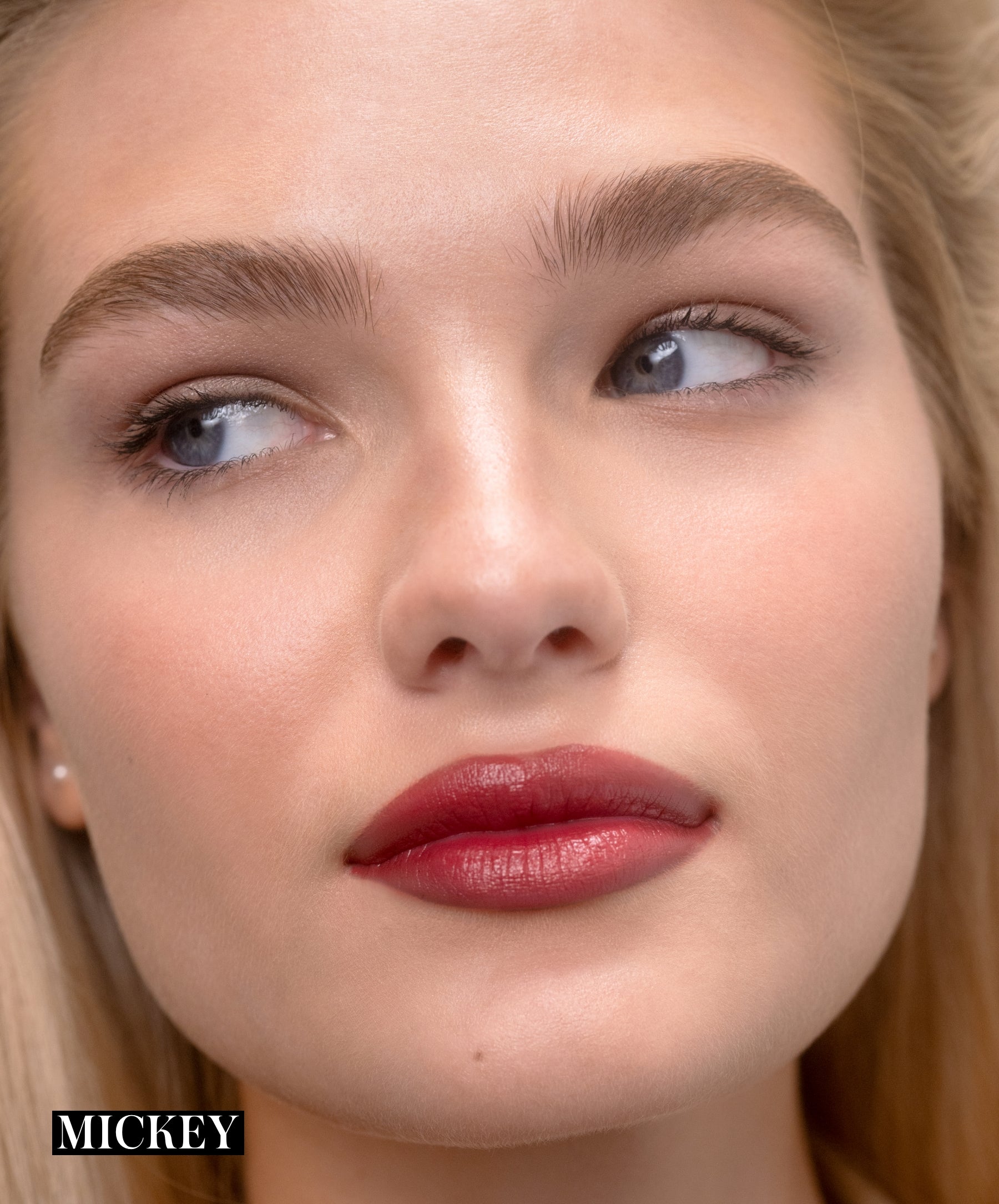 Model wearing RMS Legendary Serum Lipstick in shade Mickey