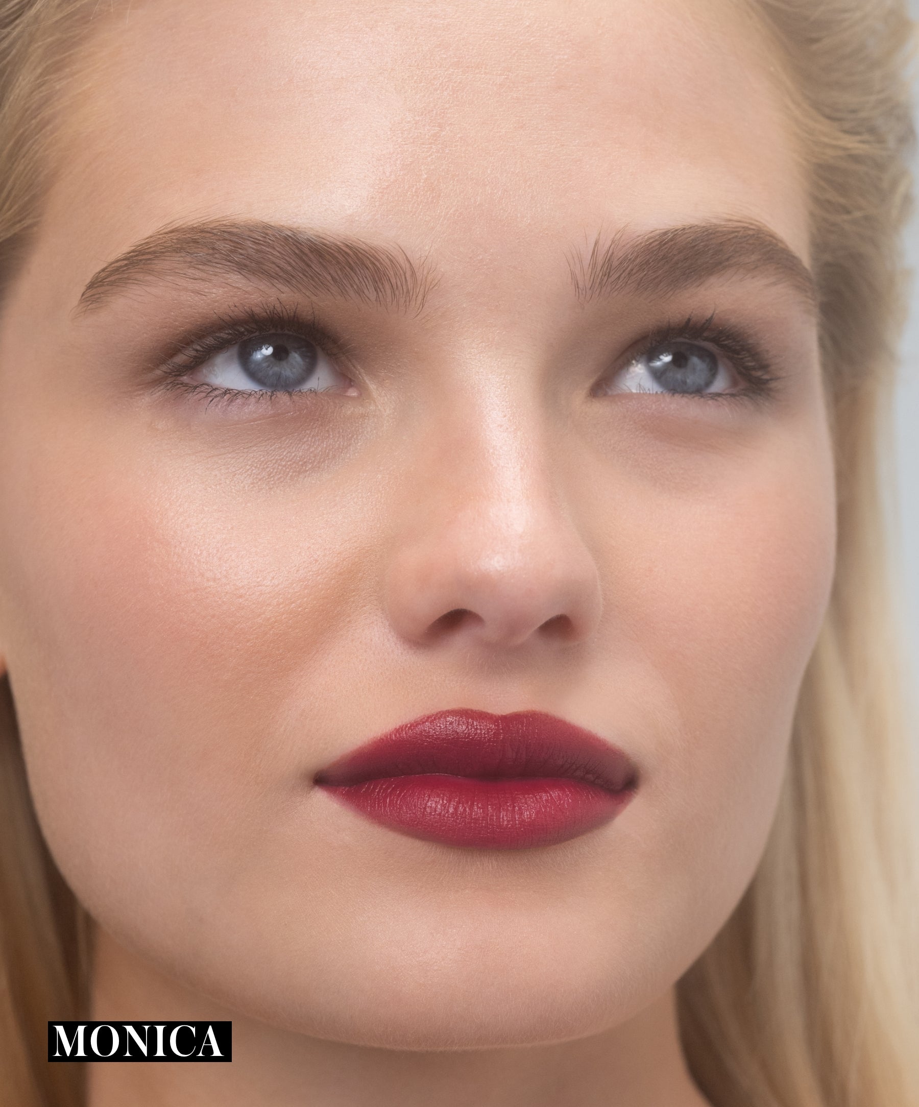 Model wearing RMS Legendary Serum Lipstick in shade Monica