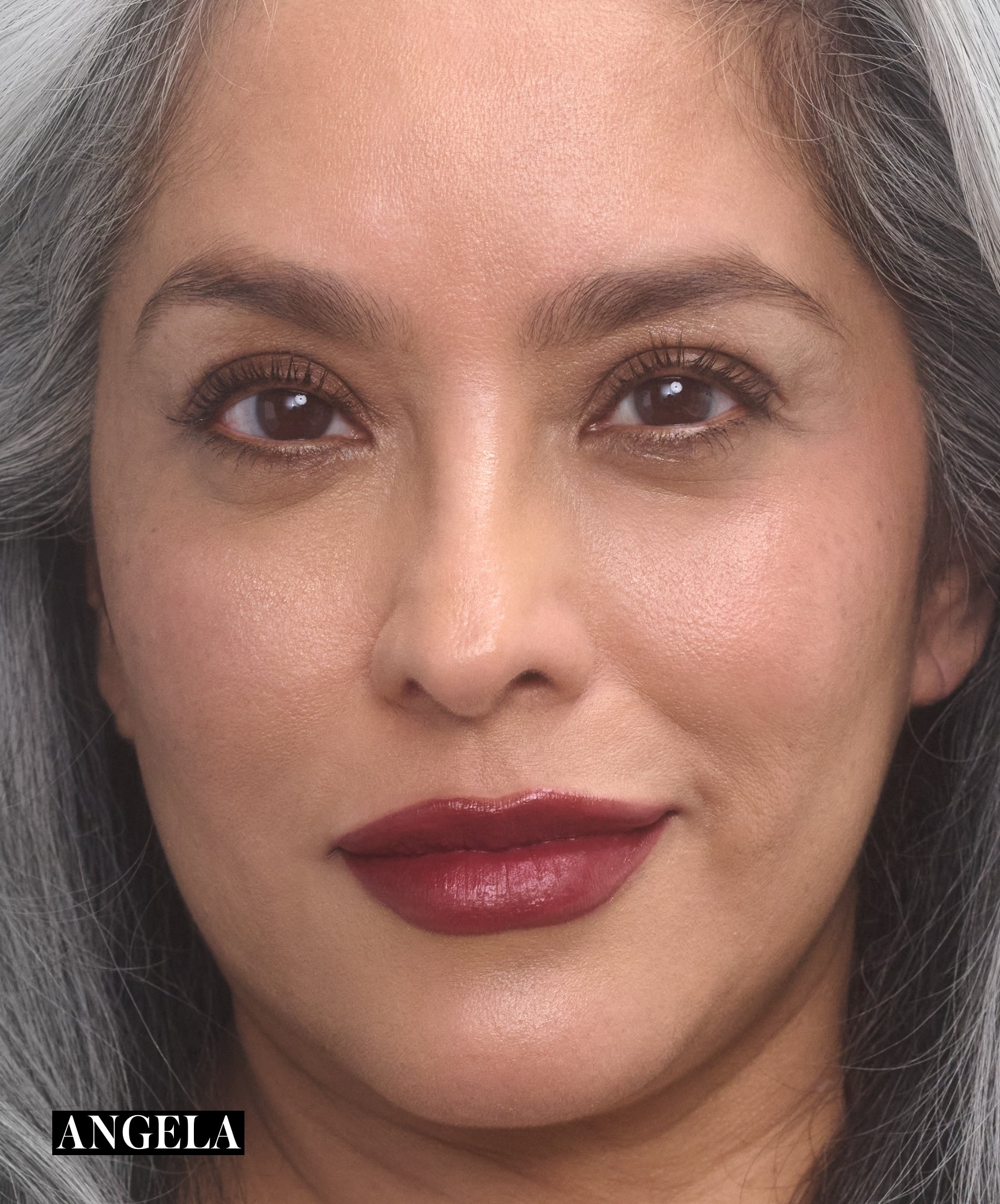 Model wearing RMS Legendary Serum Lipstick in shade Angela