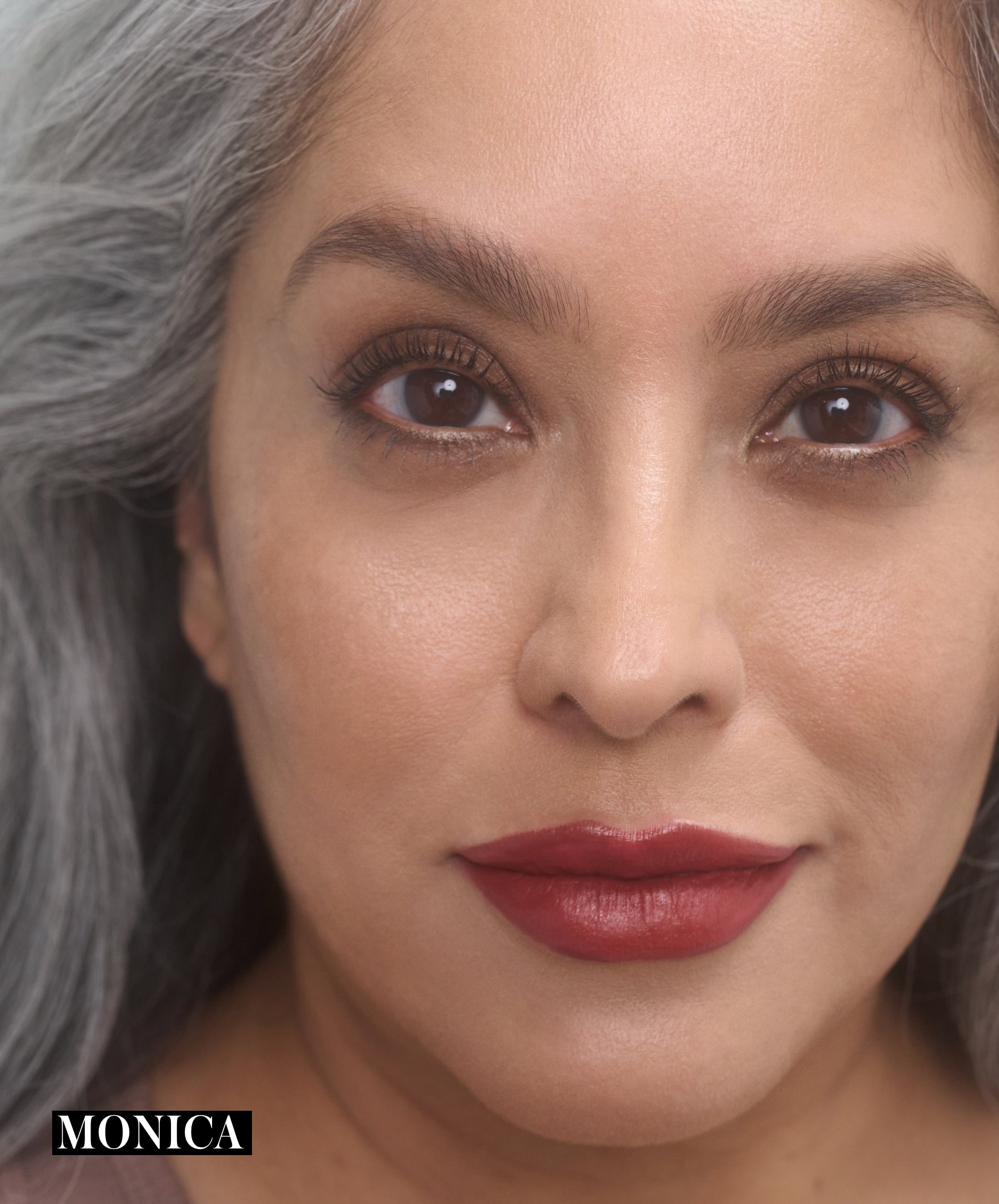 Model wearing RMS Legendary Serum Lipstick in shade Monica