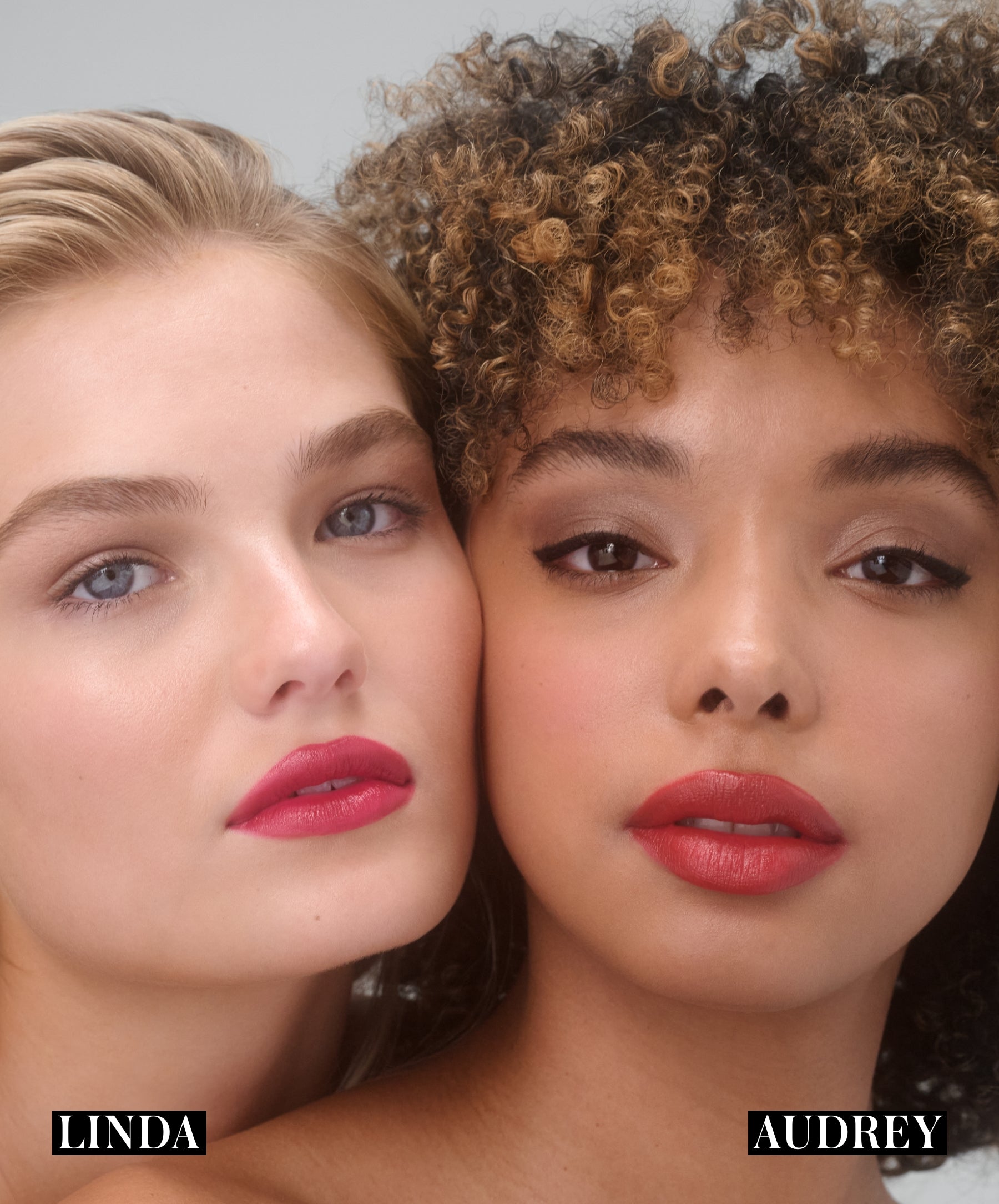 Models wearing RMS Legendary Serum Lipstick in shade Linda on the left, model on the right is wearing shade Audrey
