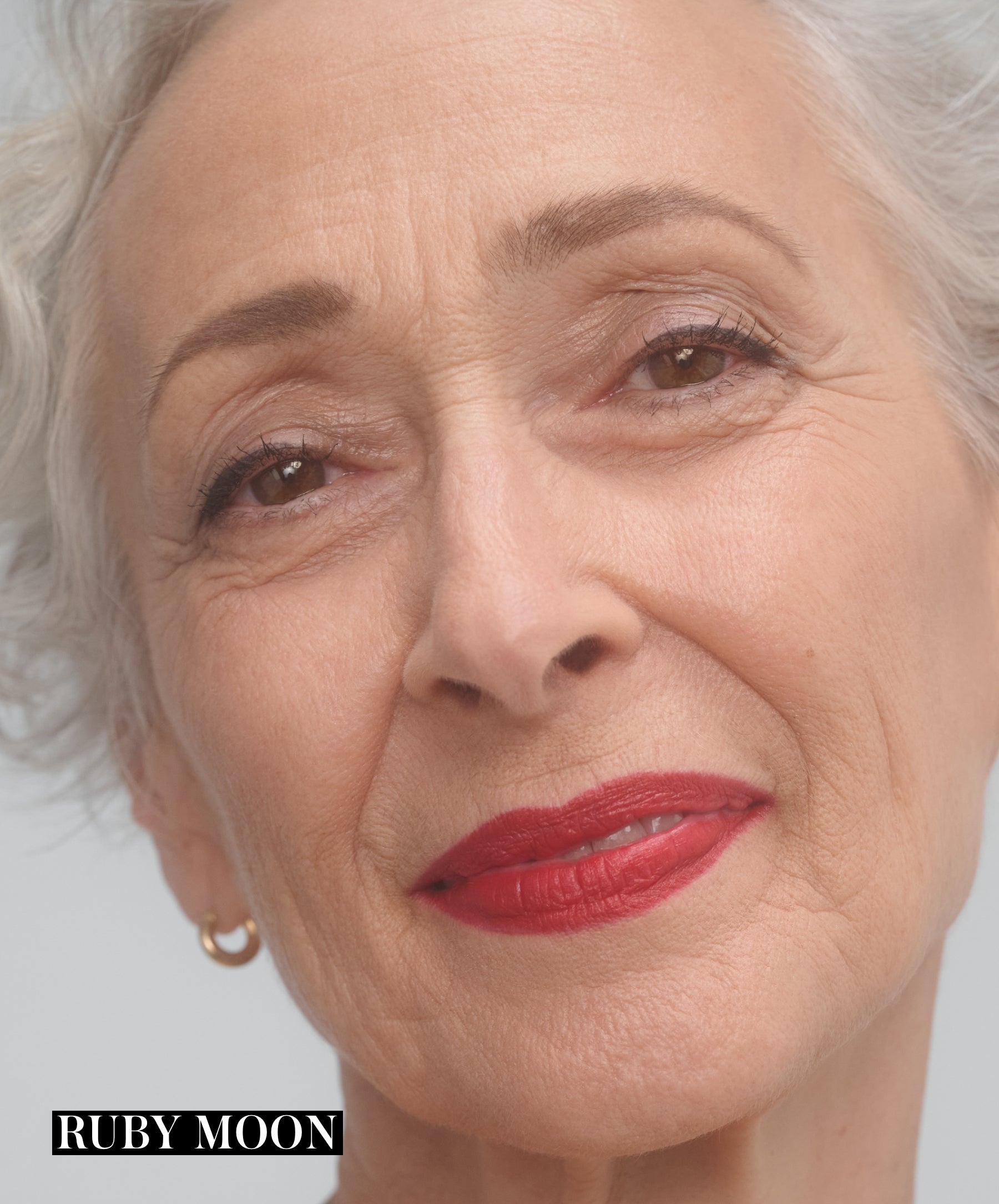 Rose-Marie Swift wearing RMS Legendary Serum Lipstick in shade Ruby Moon