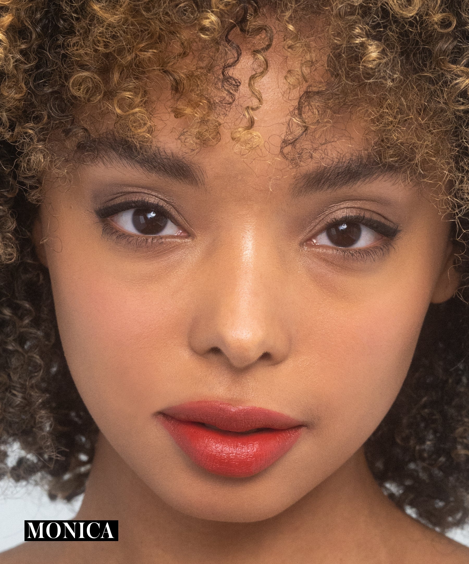 Model wearing RMS Legendary Serum Lipstick in shade Monica