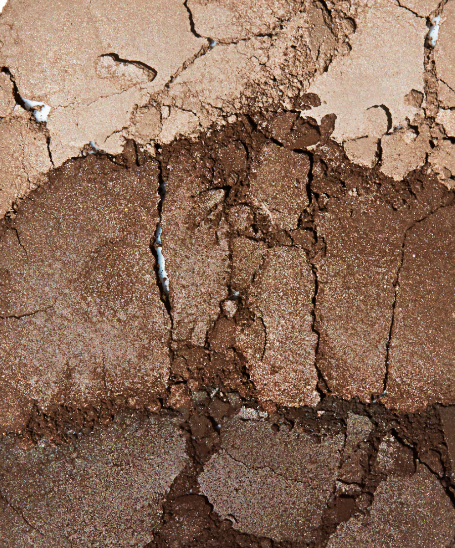 Close-up of Back2Brow Powder shades Light, Medium, Dark crushed showing velvety texture