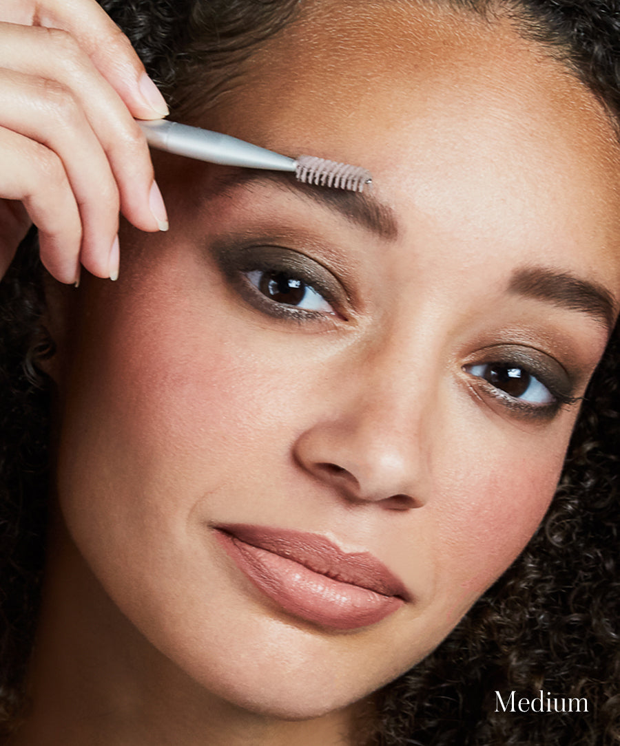 Close-up of model using Back2Brow Brush to apply Back2Brow Powder in shade Medium ideal for brown/auburn hair