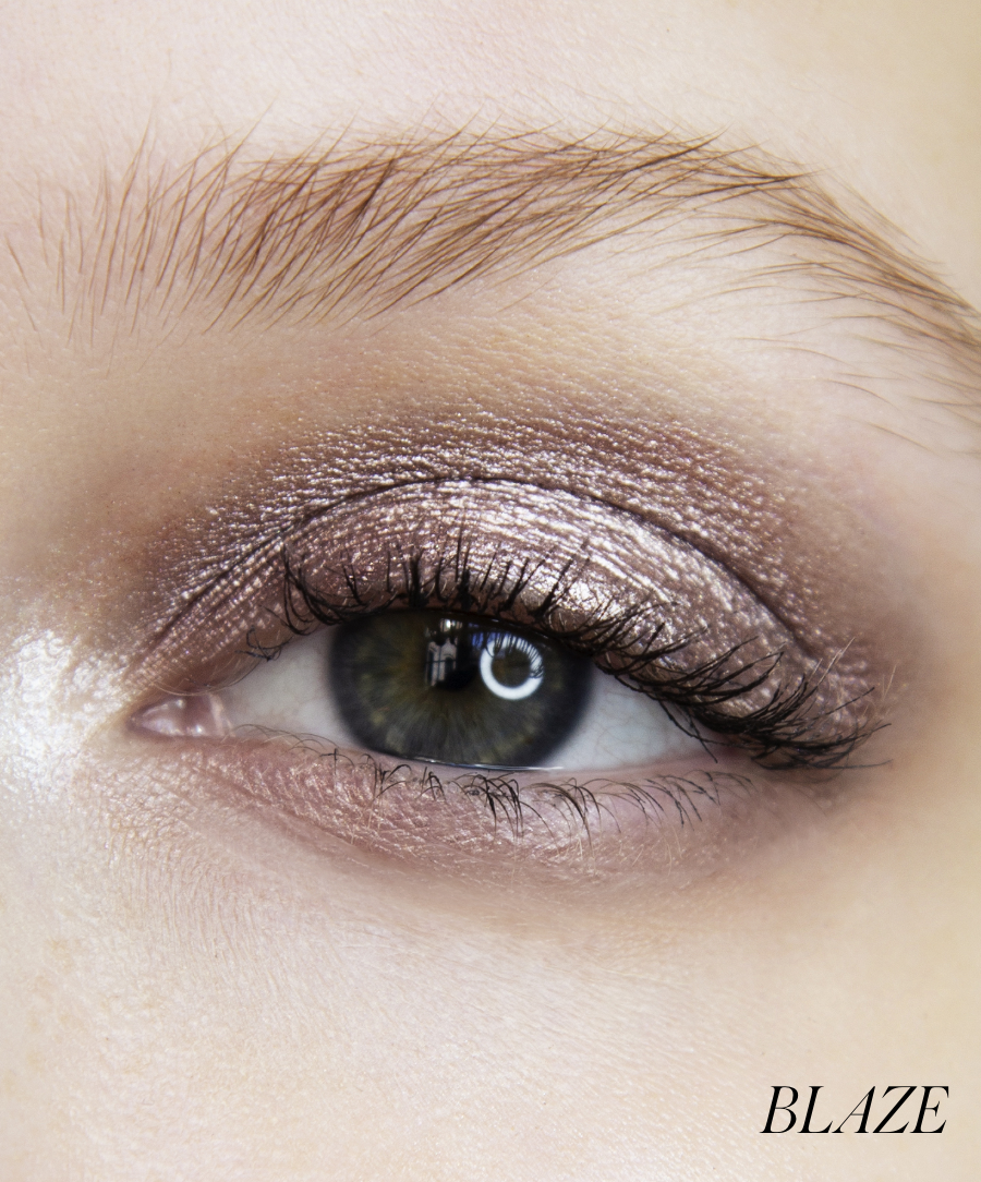 Close-up of model wearing RMS Eyelights Cream Eyeshadow in shade Blaze