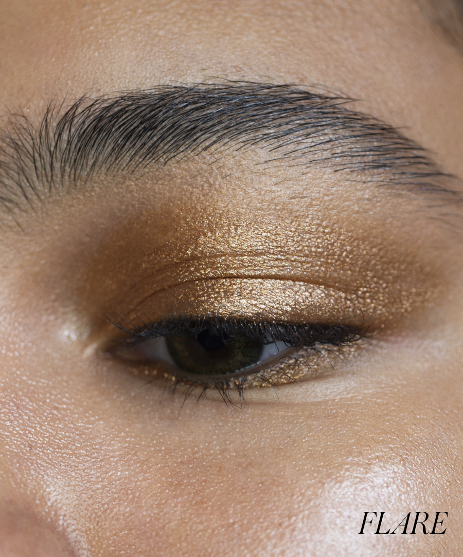 Close-up of model wearing RMS Eyelights Cream Eyeshadow in shade Flare
