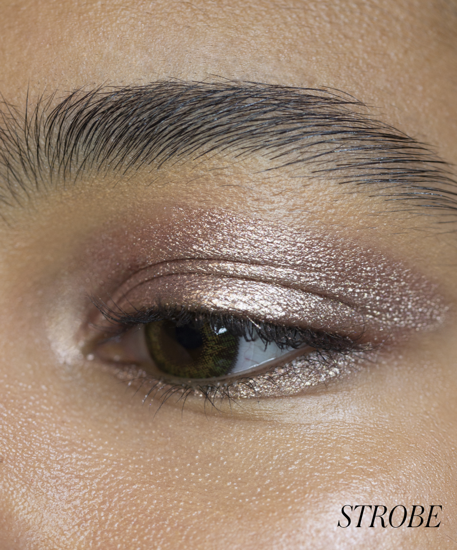 Close-up of model wearing RMS Eyelights Cream Eyeshadow in shade Strobe