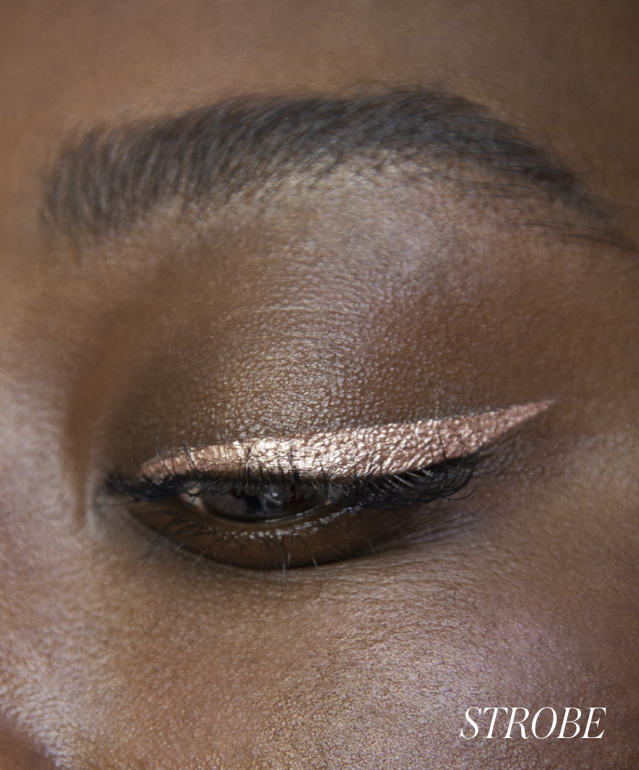Close-up of model wearing RMS Eyelights Cream Eyeshadow in shade Strobe