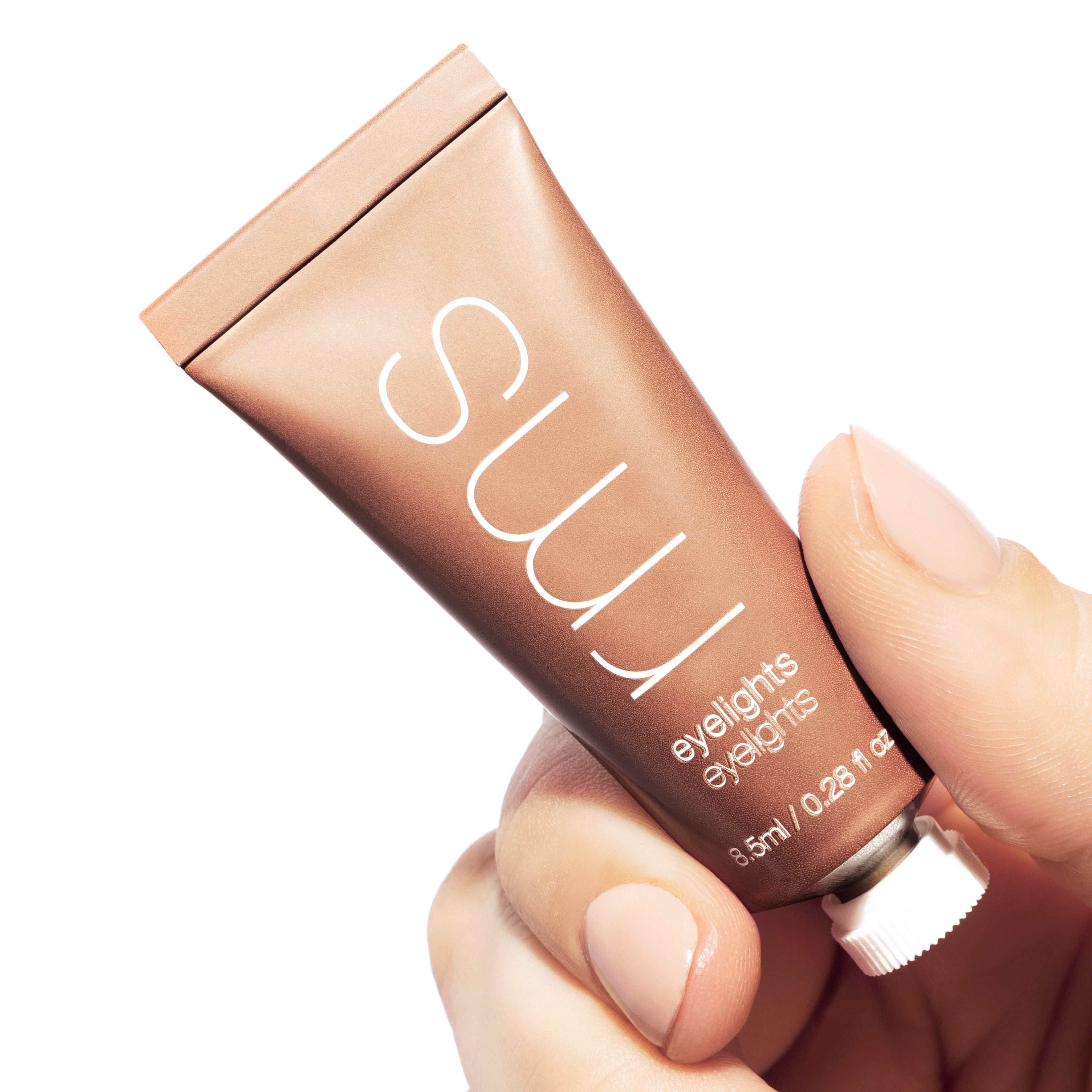 RMS Eyelights Cream Eyeshadow shade Spark in hand