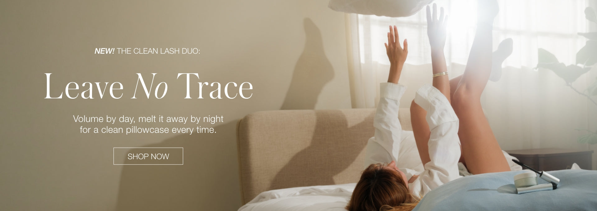 Website banner showing a person relaxing in bed beside a sunlit window, with text reading Leave No Trace and a Shop Now button.