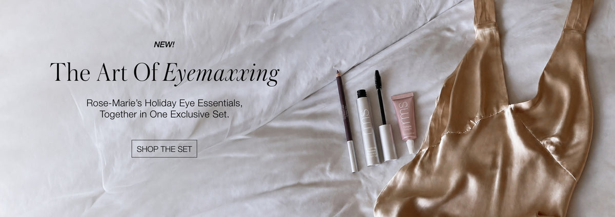 Editorial beauty banner with makeup items and a champagne satin camisole on white bedding. Text reads The Art Of Evenmarring and Shop the Set