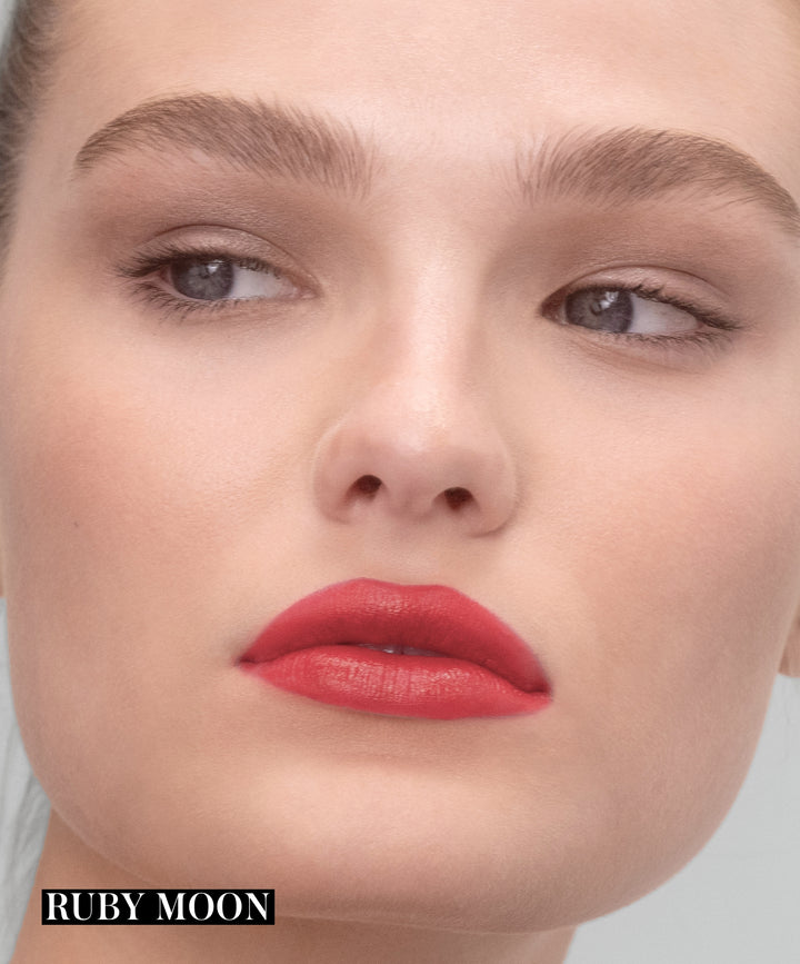 Model wearing RMS Legendary Serum Lipstick in shade Ruby Moon