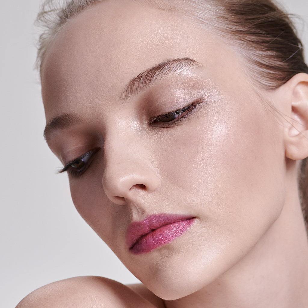 Model wearing Tinted Daily Lip Balm