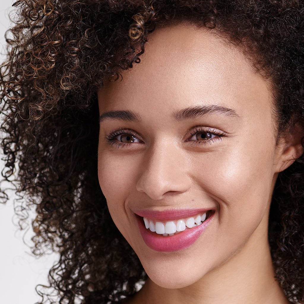 Model wearing Tinted Daily Lip Balm